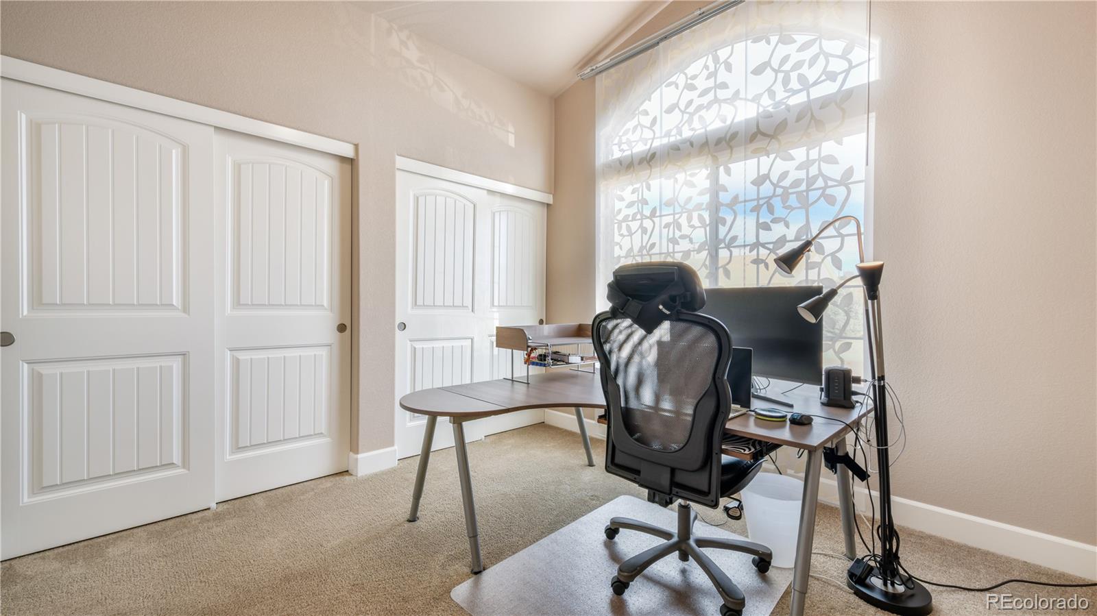 10484 Mile Post Loop Fountain, CO 80817 - Photo 25 of 50 a view of a workspace with furniture and a window
