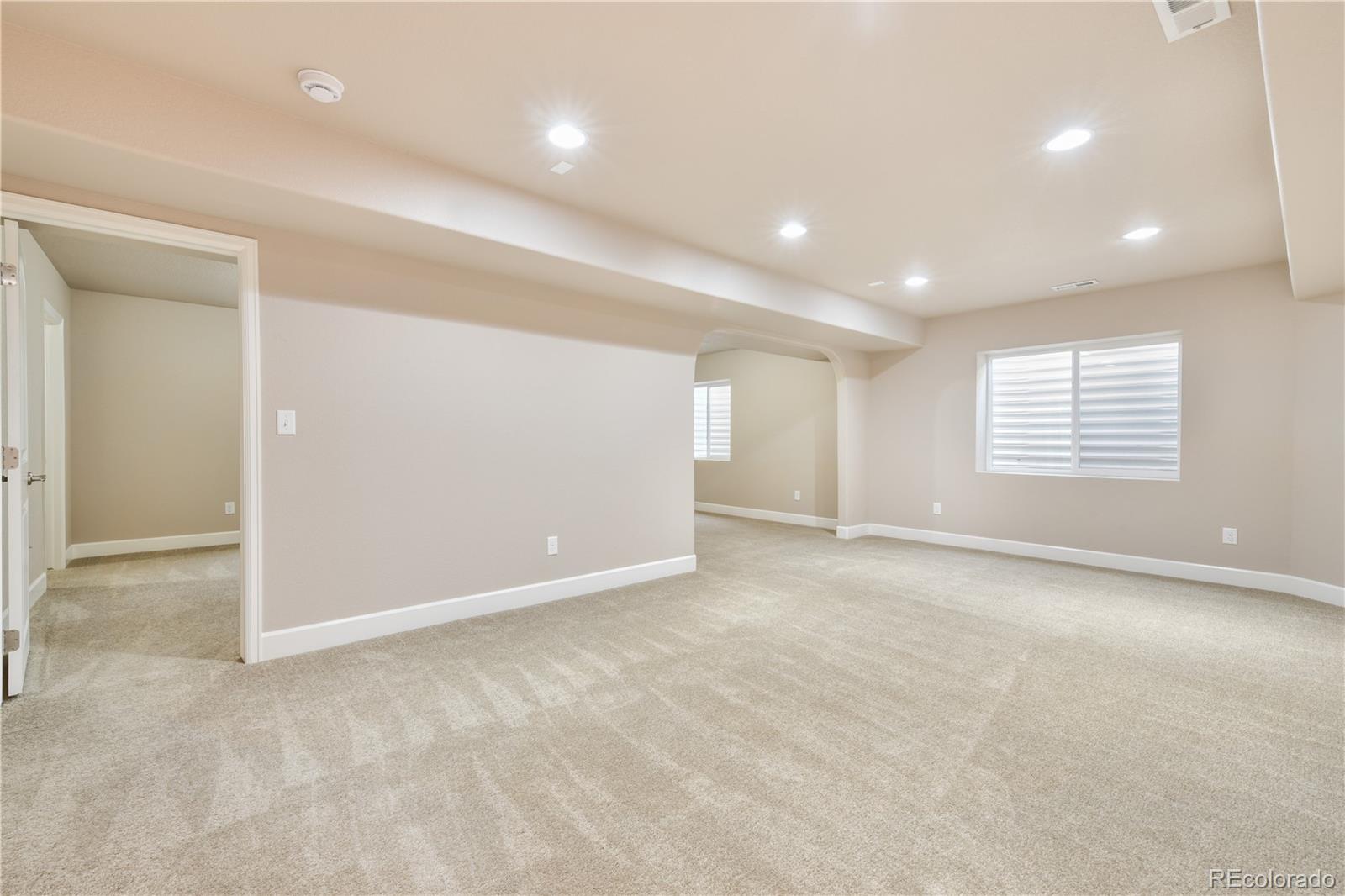 10484 Mile Post Loop Fountain, CO 80817 - Photo 31 of 50 an empty room with windows and pillars in it