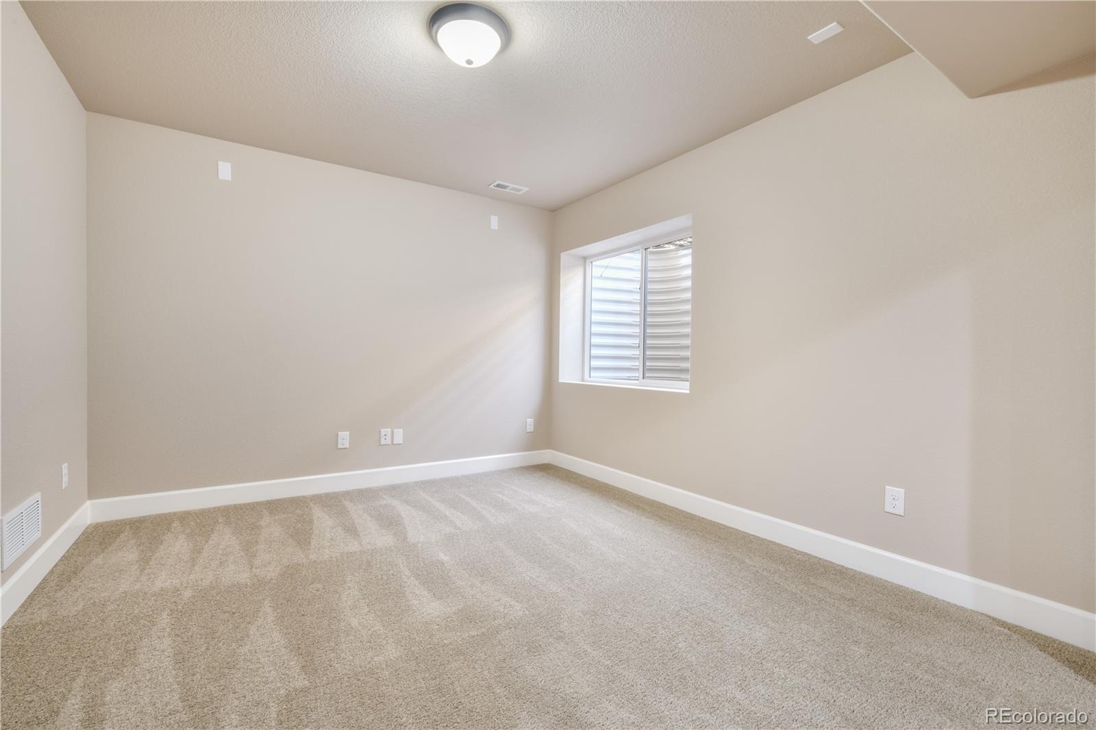 10484 Mile Post Loop Fountain, CO 80817 - Photo 34 of 50 an empty room with windows