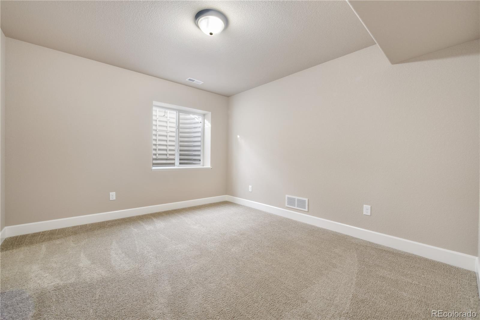 10484 Mile Post Loop Fountain, CO 80817 - Photo 36 of 50 an empty room with windows