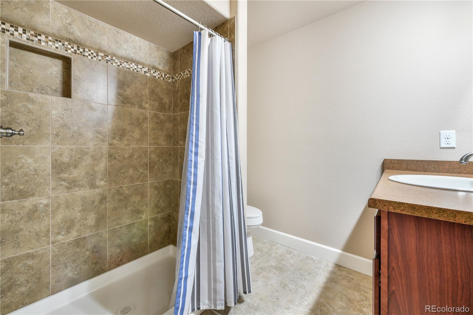 10484 Mile Post Loop Fountain, CO 80817 - Photo 37 of 50 a bathroom with a shower and a sink