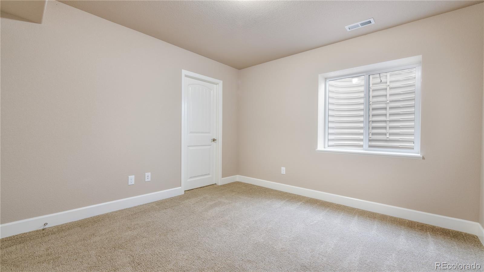 10484 Mile Post Loop Fountain, CO 80817 - Photo 39 of 50 an empty room with a window