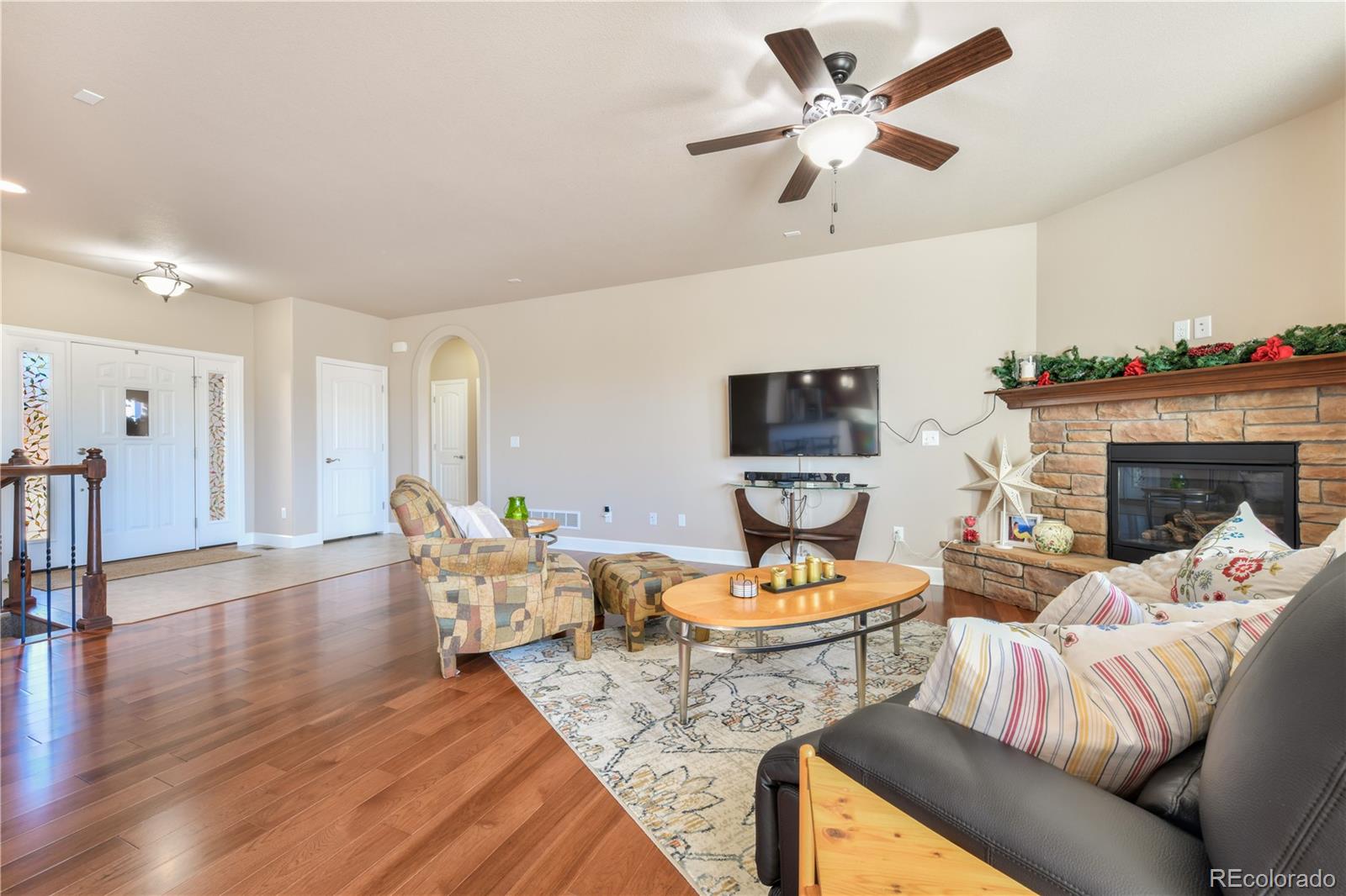 10484 Mile Post Loop Fountain, CO 80817 - Photo 9 of 50 a living room with furniture and a fireplace