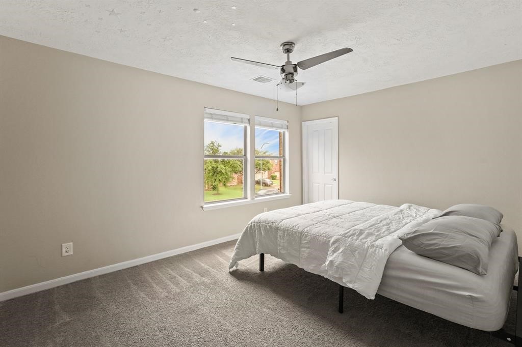6719 Path Way Court Katy, TX 77449 - Photo 31 of 35 a bedroom with a bed and window