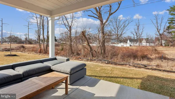 a outdoor space with patio the couches and pool table and chairs