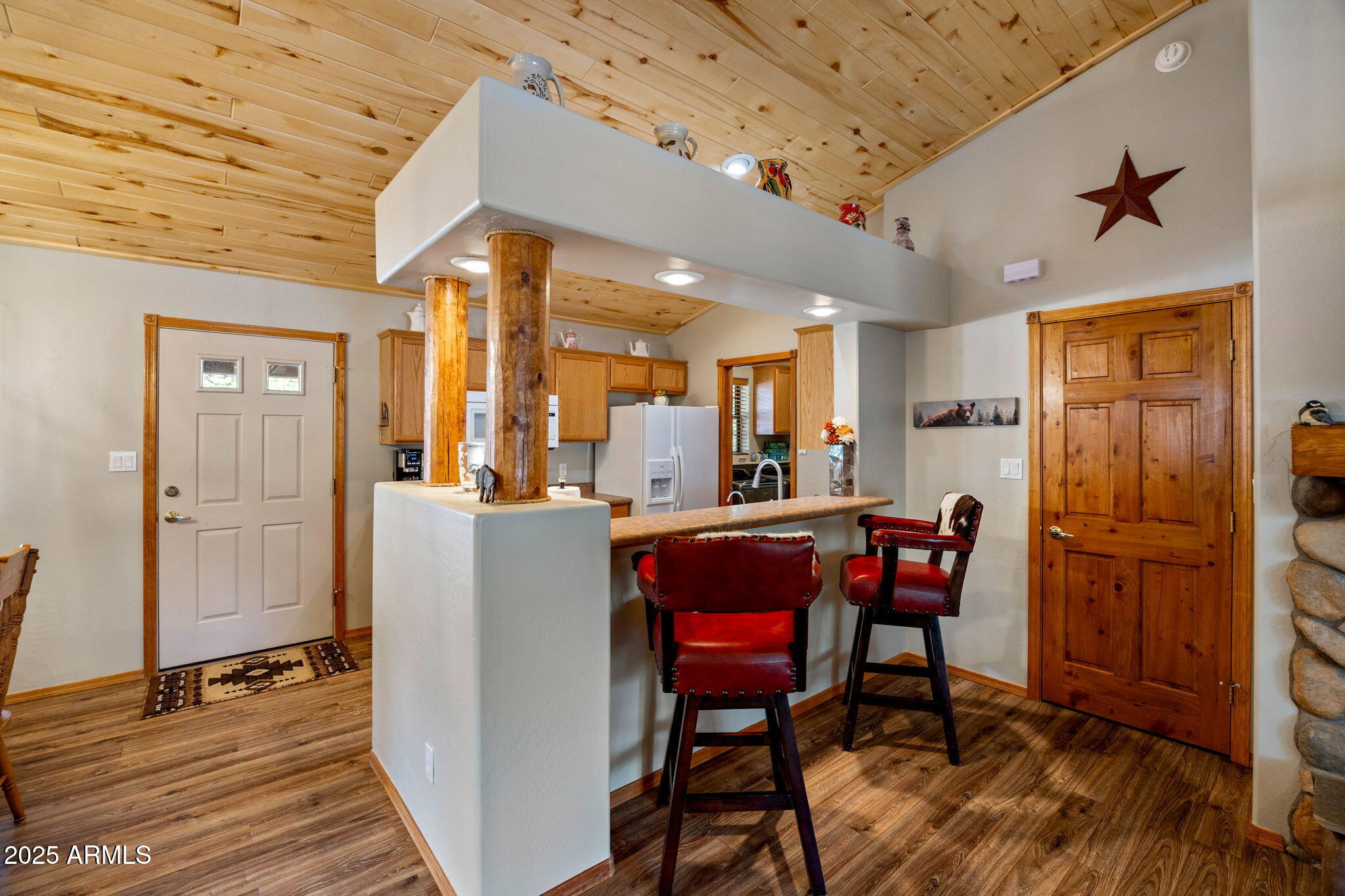 2692 Palomino Trail Overgaard, AZ 85933 - Photo 9 of 33 a dining room with furniture and a refrigerator