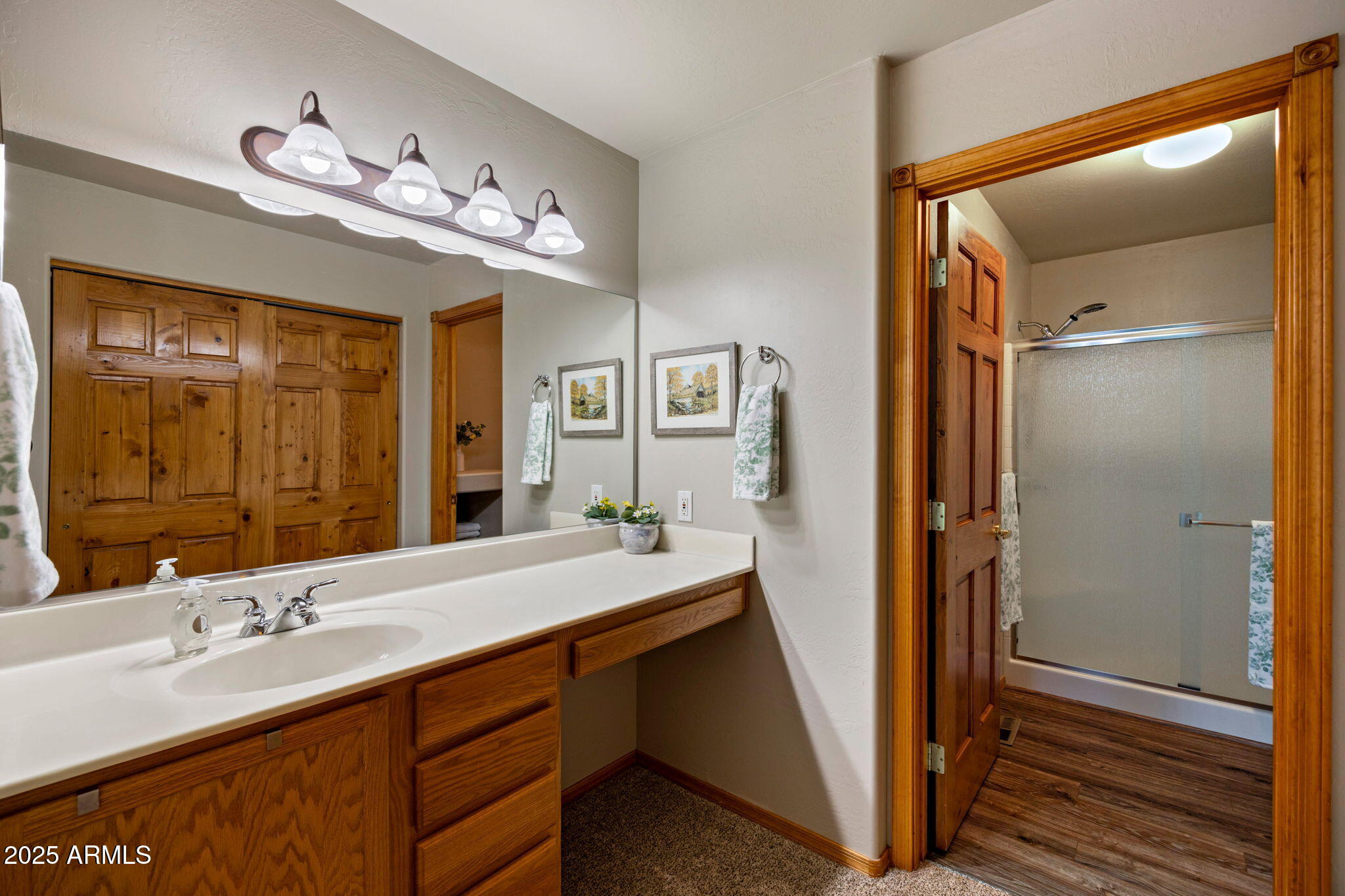 2692 Palomino Trail Overgaard, AZ 85933 - Photo 15 of 33 a bathroom with a double vanity sink mirror and double