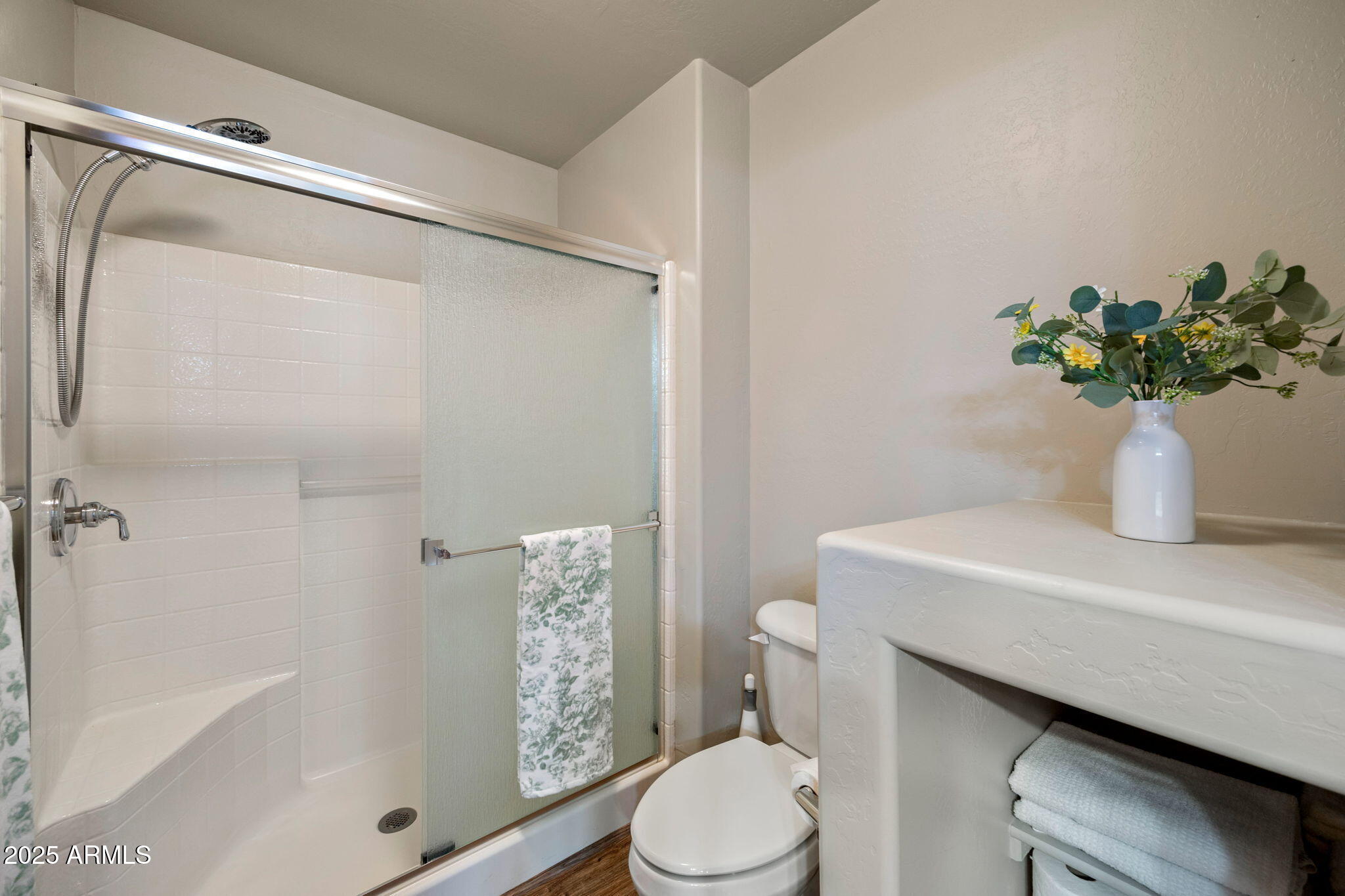 2692 Palomino Trail Overgaard, AZ 85933 - Photo 16 of 33 a bathroom with a sink a toilet and shower