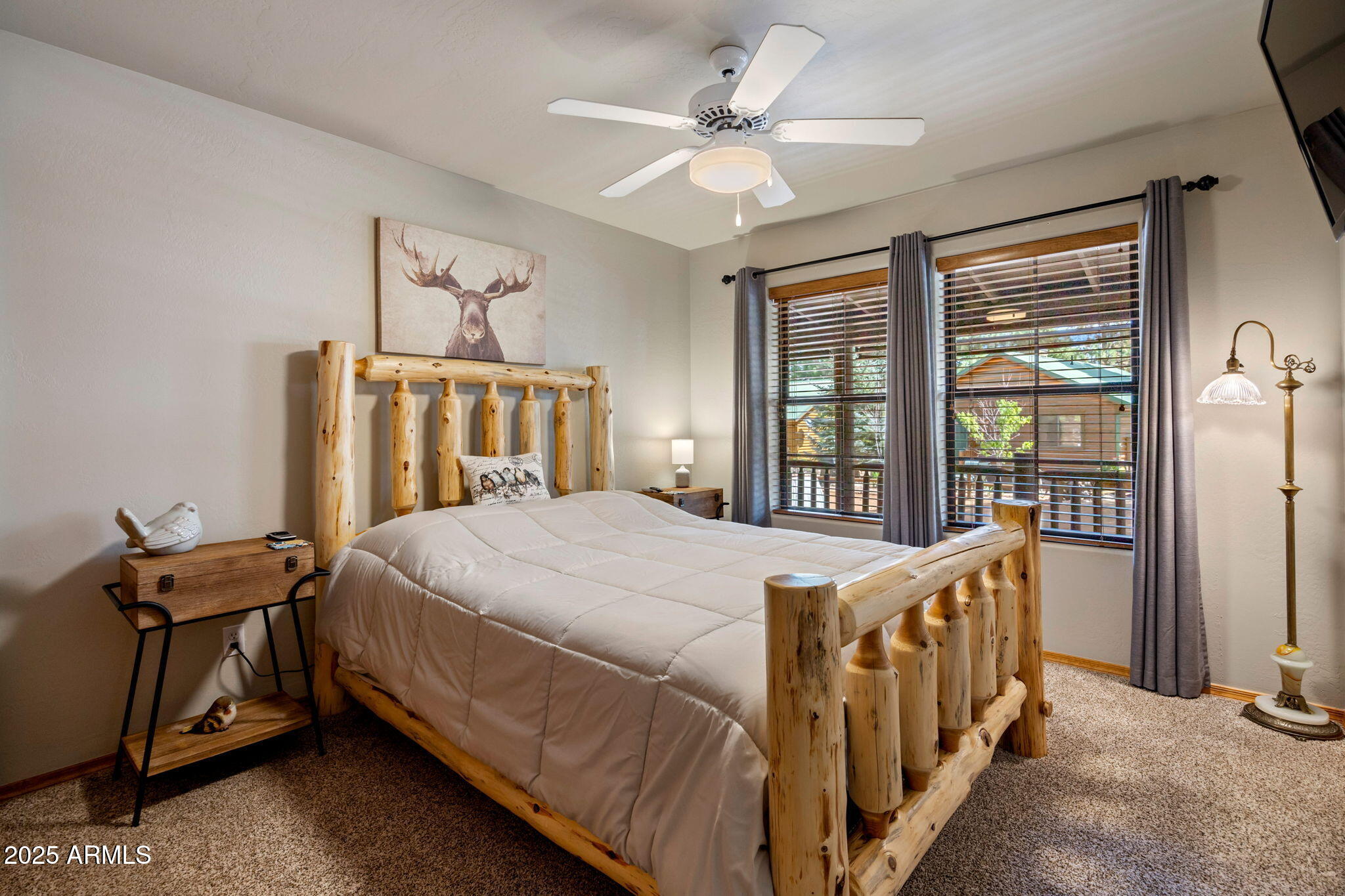 2692 Palomino Trail Overgaard, AZ 85933 - Photo 17 of 33 a bed sitting in a bedroom next to a window