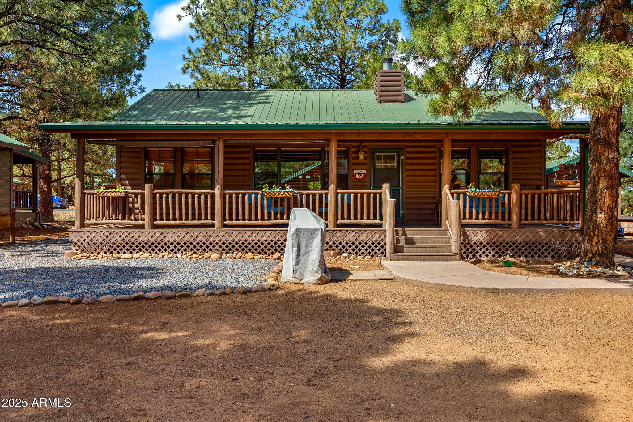 2692 Palomino Trail Overgaard, AZ 85933 - Photo 22 of 33 a view of a house with a small yard and wooden fence