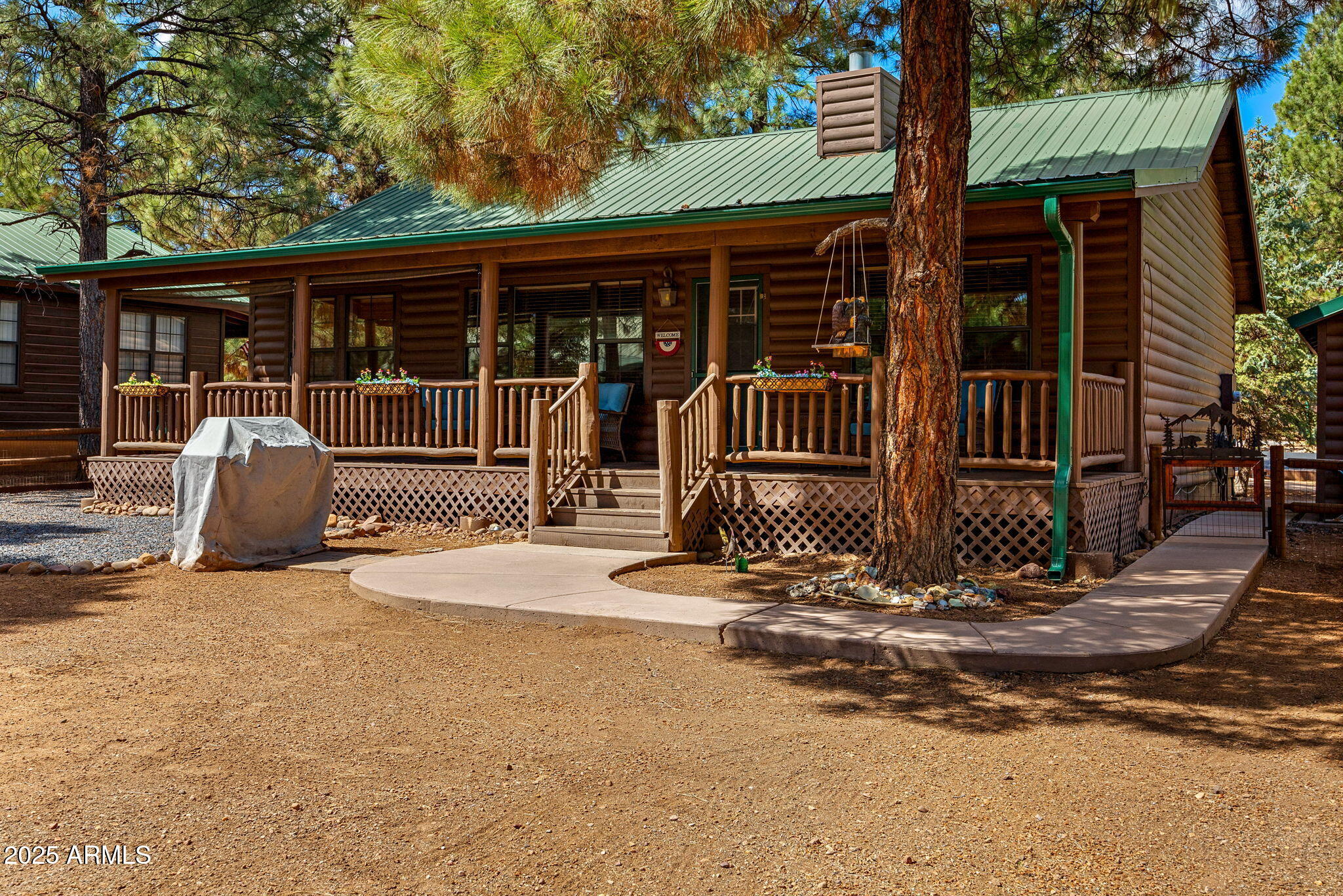 2692 Palomino Trail Overgaard, AZ 85933 - Photo 23 of 33 a backyard of a house with yard and outdoor seating