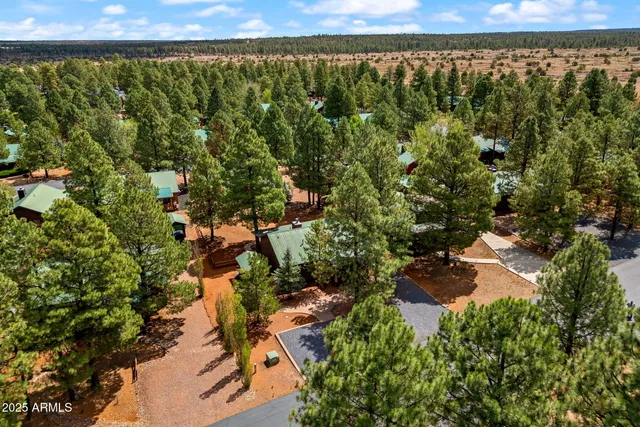 a view of a house with a small backyard