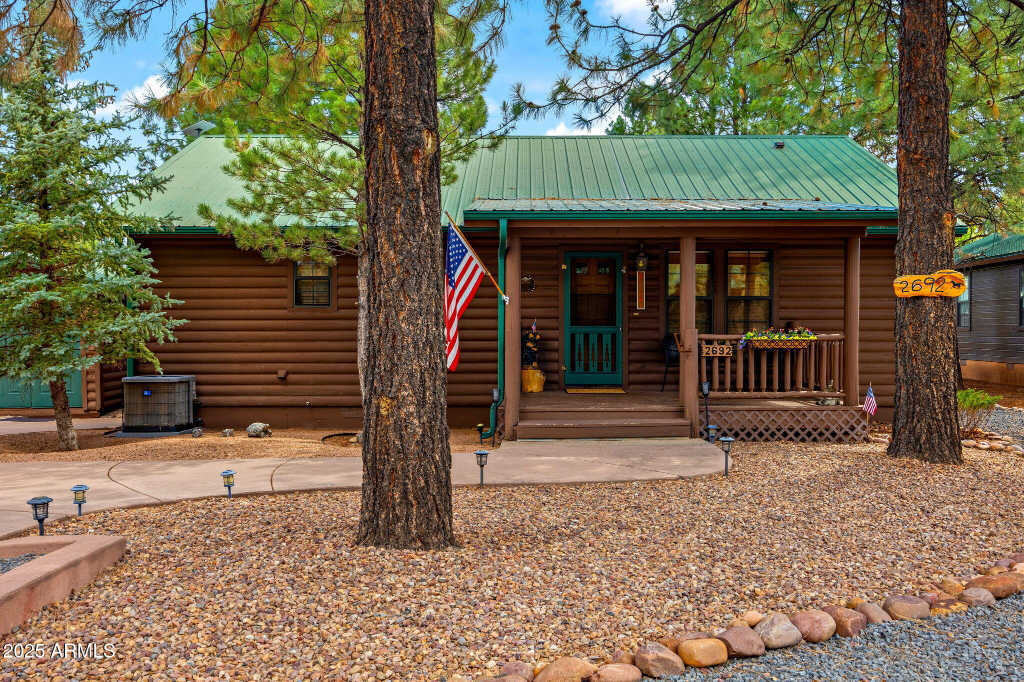 2692 Palomino Trail Overgaard, AZ 85933 - Photo 2 of 33 a front view of a house with a porch