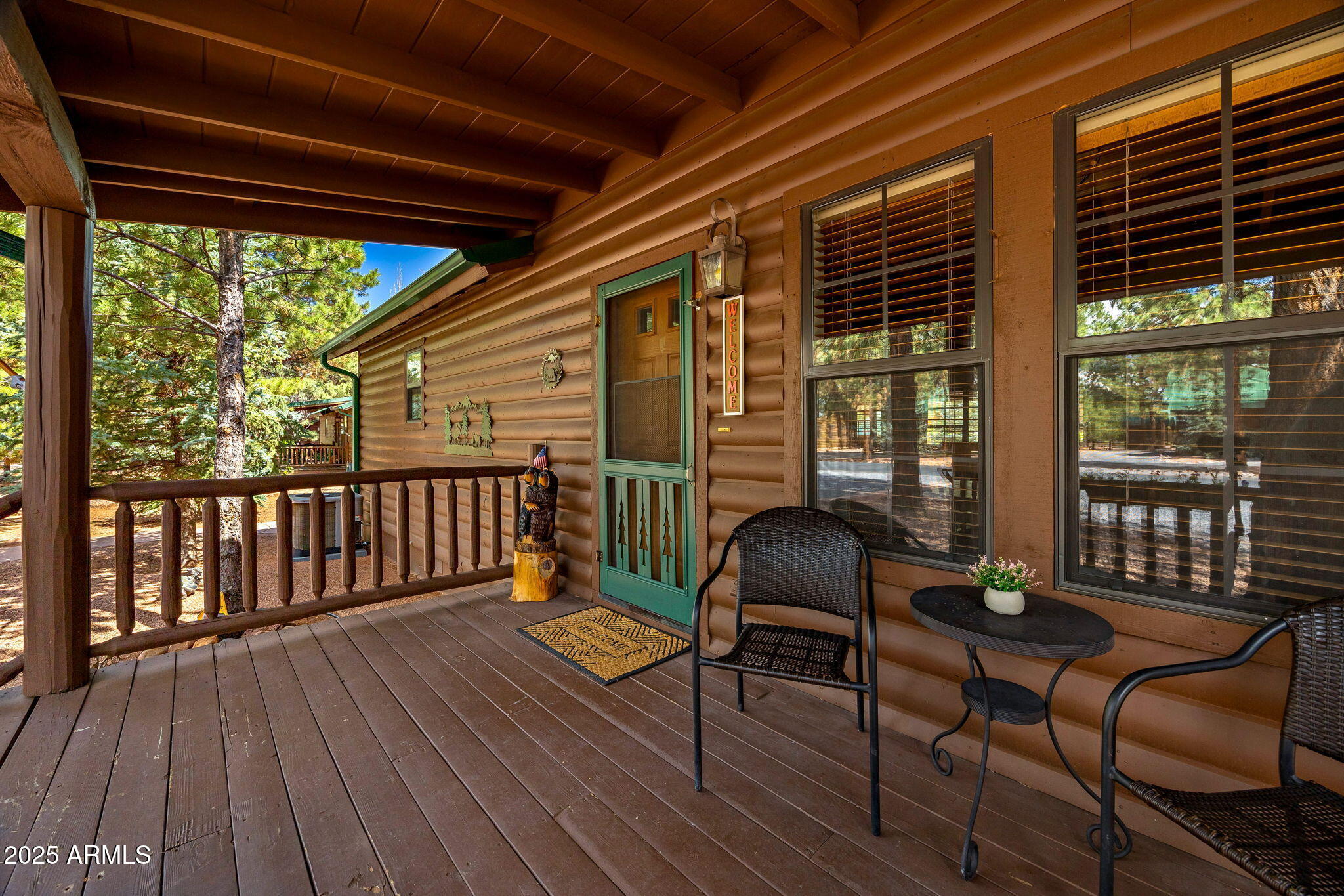 2692 Palomino Trail Overgaard, AZ 85933 - Photo 5 of 33 a balcony with furniture and wooden floor