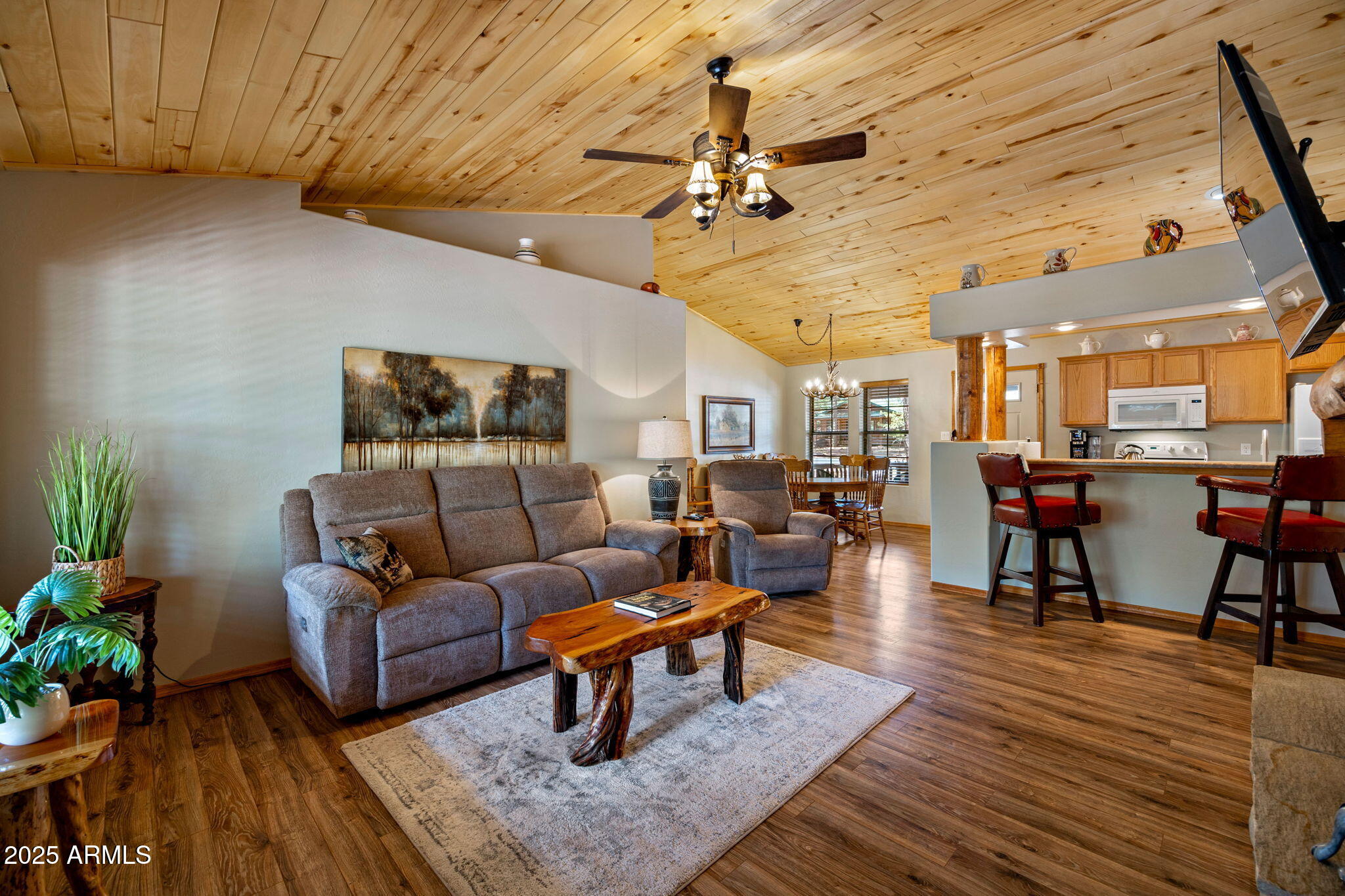 2692 Palomino Trail Overgaard, AZ 85933 - Photo 7 of 33 a living room with furniture and a chandelier