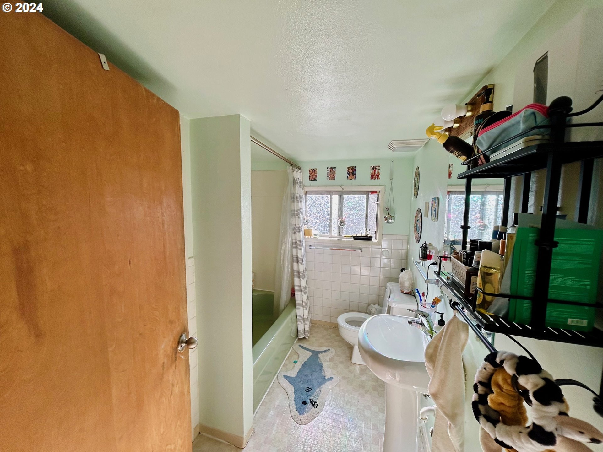 1539 Villard Street Eugene, OR 97403 - Photo 13 of 13 a bathroom with a sink toilet and shower