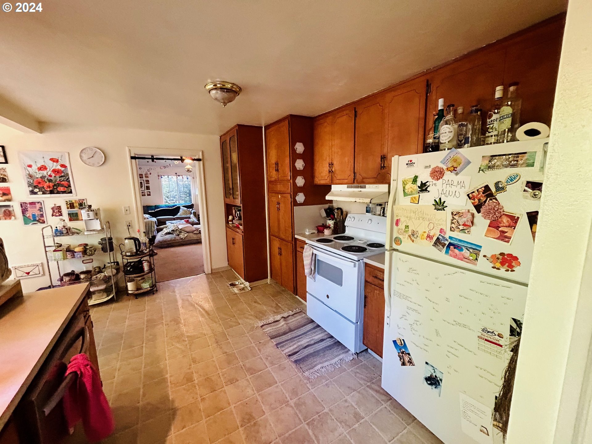 1539 Villard Street Eugene, OR 97403 - Photo 6 of 13 a kitchen with granite countertop a refrigerator and a stove top oven