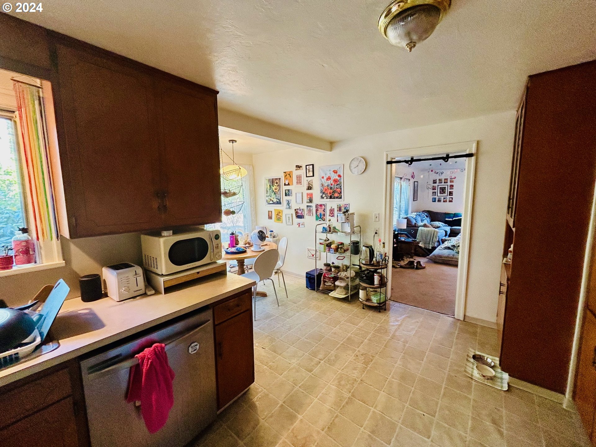 1539 Villard Street Eugene, OR 97403 - Photo 8 of 13 a bed room with furniture and a flat screen tv