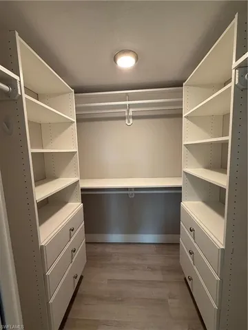 a view of an empty walk in closet