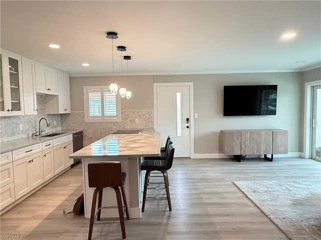 a kitchen with a table and chairs in it