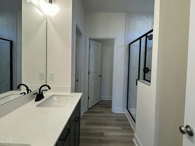 a bathroom with a sink and mirror
