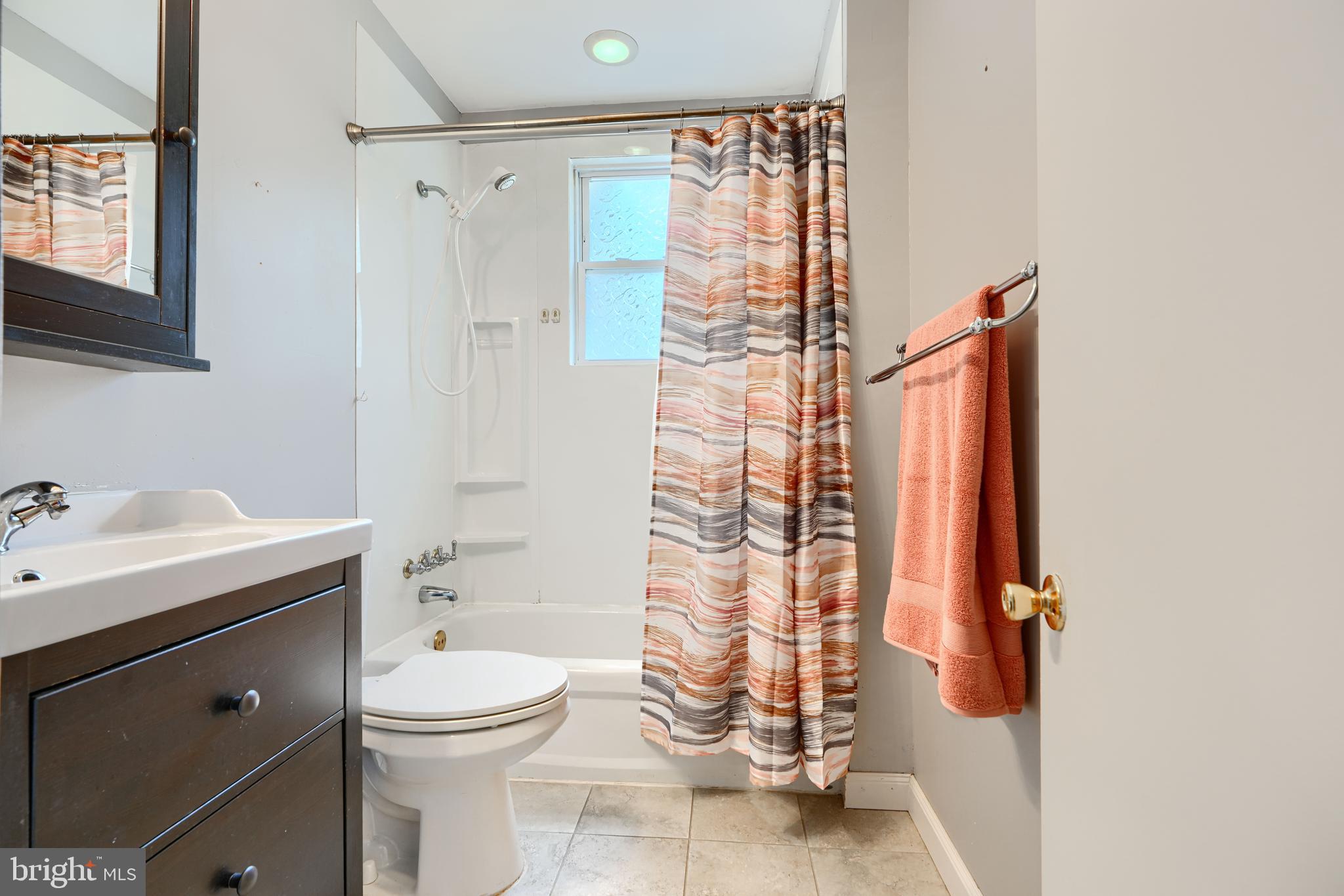 235 Trappe Road Baltimore, MD 21222 - Photo 24 of 37 a bathroom with a granite countertop sink a toilet and shower