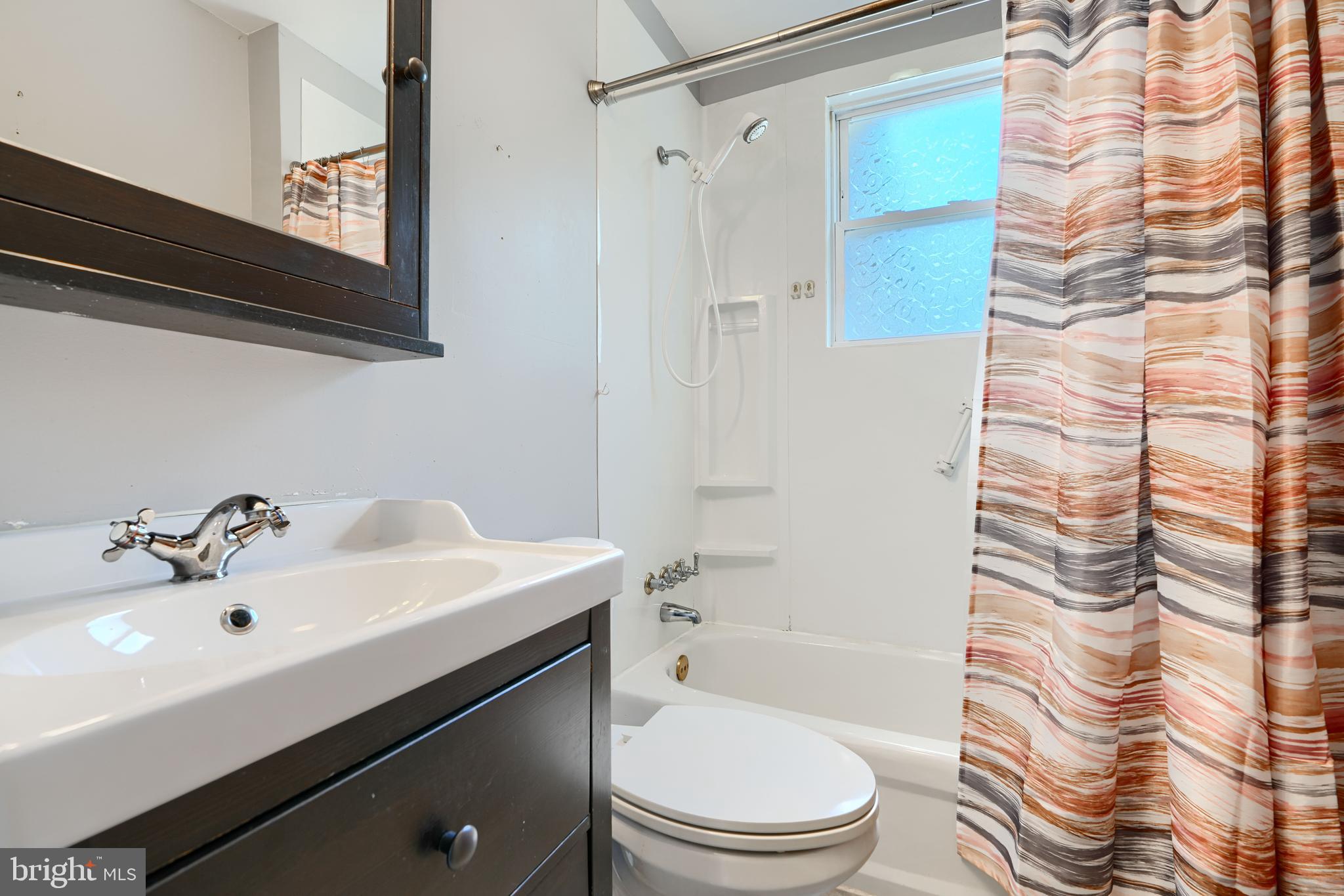 235 Trappe Road Baltimore, MD 21222 - Photo 25 of 37 a bathroom with a sink a toilet and shower