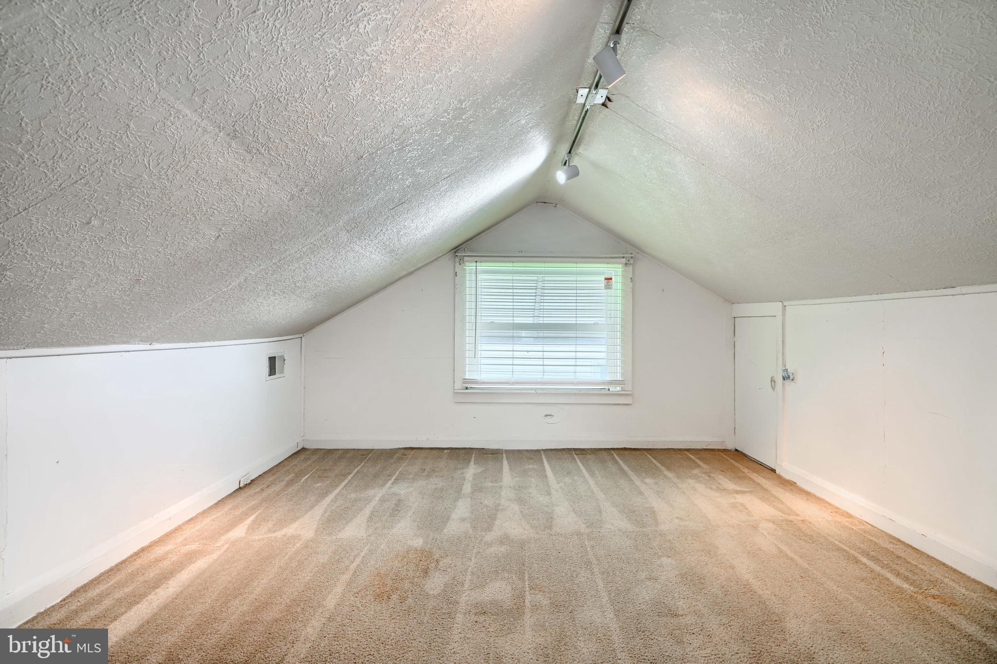 235 Trappe Road Baltimore, MD 21222 - Photo 28 of 37 an empty room with wooden floor and windows