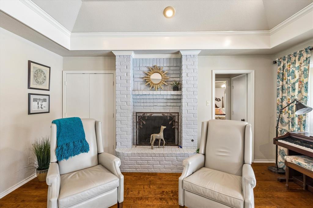 404 Moonlight Lane Keller, TX 76248 - Photo 9 of 40 a living room with furniture and a fireplace