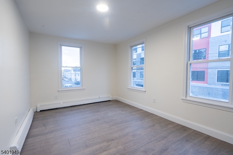 445 Summer Street Paterson, NJ 07501 - Photo 11 of 12 an empty room with a window
