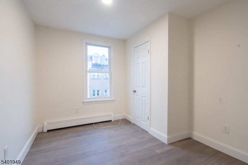 445 Summer Street Paterson, NJ 07501 - Photo 12 of 12 an empty room with window