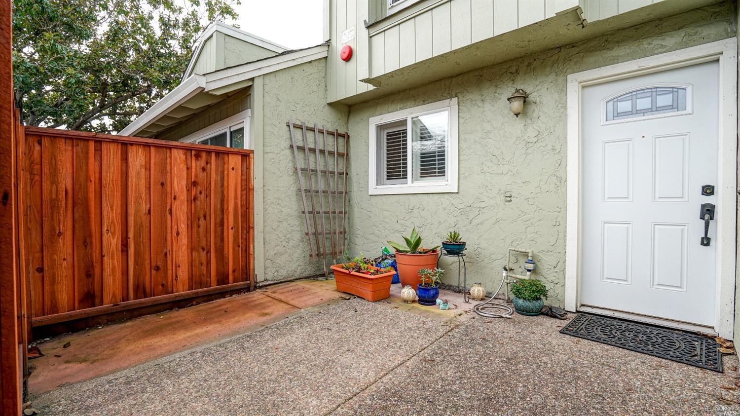 676 Racquet Club Circle Rohnert Park, CA 94928 - Photo 1 of 1 a backyard of a house with table and chairs