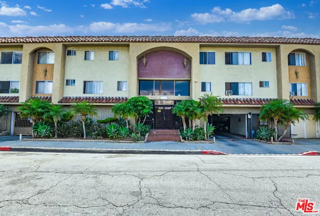 a view of a garage with cars