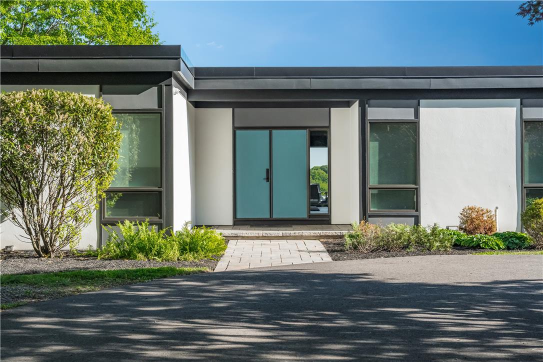 1506 Pleasant View Road Coopersburg, PA 18036 - Photo 2 of 97 Modern facade with a flat roof and striking teal double doors welcomes you home.