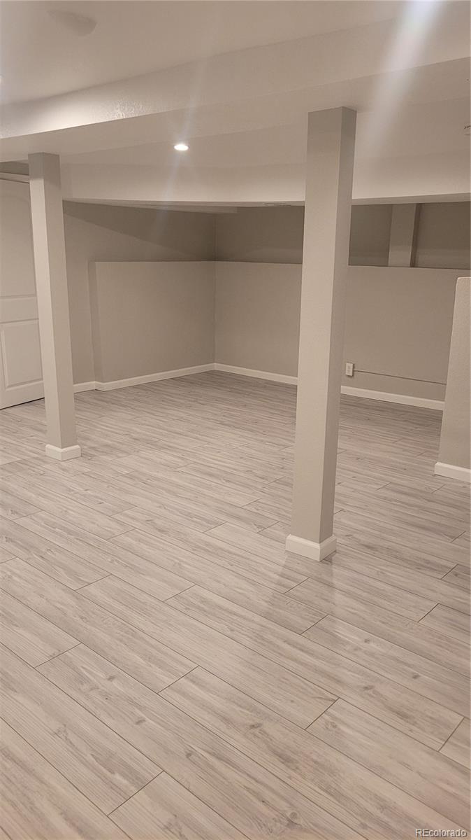 2834 Curtis Street, Unit 3 Denver, CO 80205 - Photo 3 of 22 a view of empty room with wooden floor