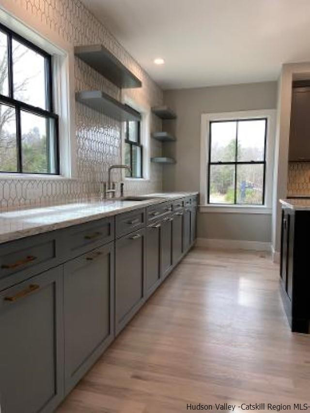 194 Lower Sahler Mill Road Olivebridge, NY 12461 - Photo 8 of 16 a kitchen with stainless steel appliances granite countertop a sink a stove a counter space and a large window