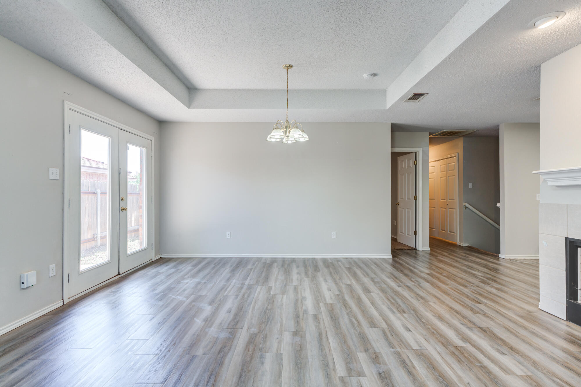 3425 97th Street Lubbock, TX 79423 - Photo 3 of 22 a view of a room with wooden floor and window