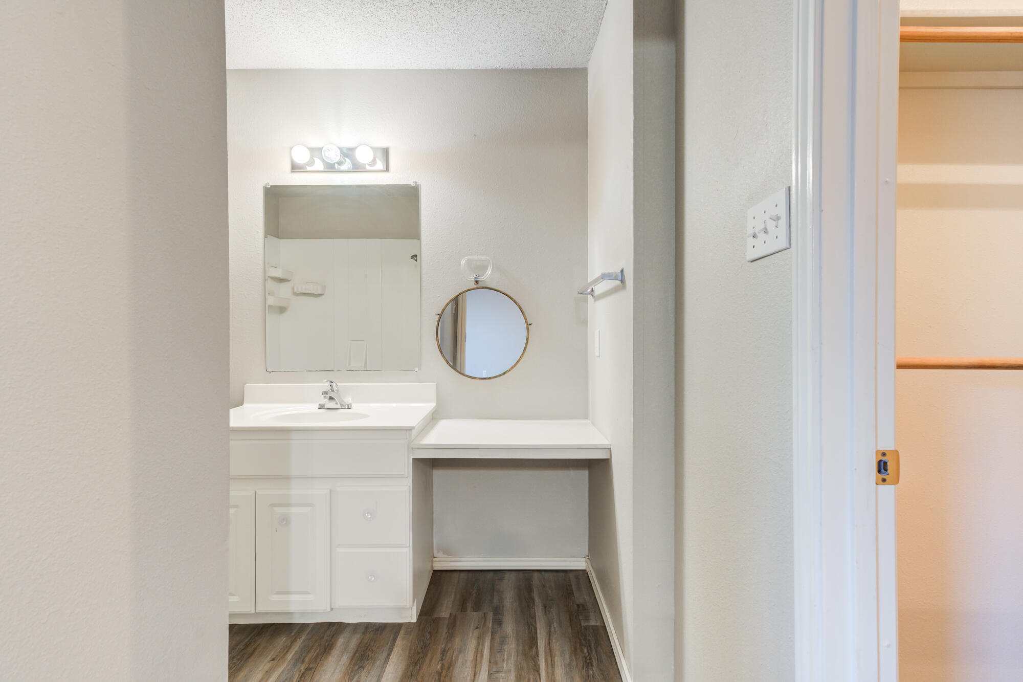 3425 97th Street Lubbock, TX 79423 - Photo 9 of 22 a bathroom with a sink and a mirror