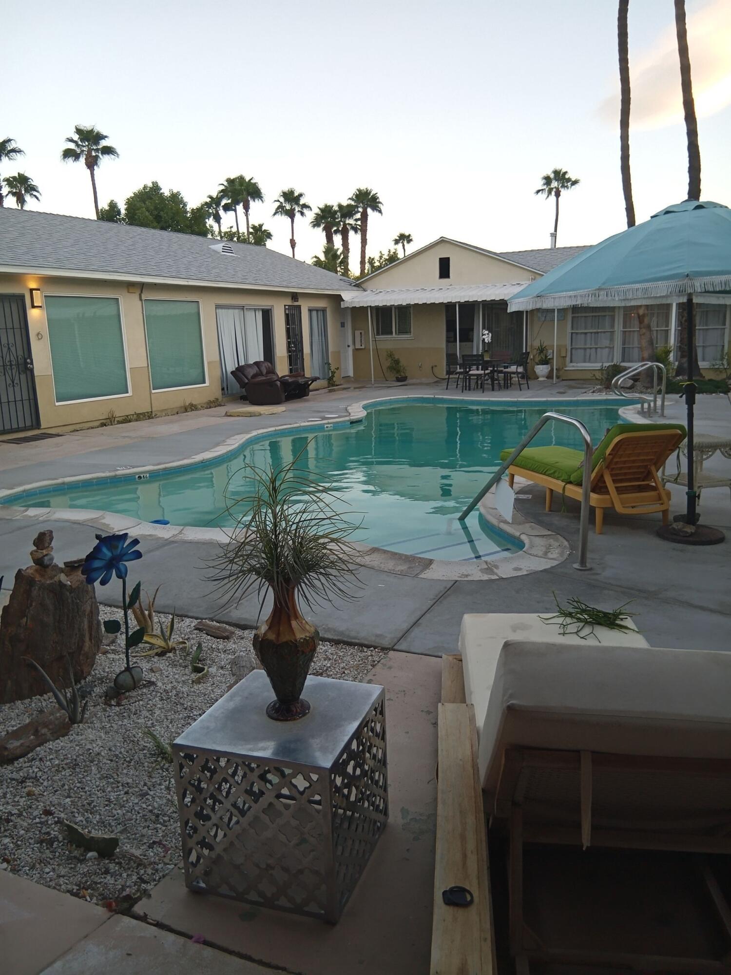 315 East Stevens Road, Unit 4 Palm Springs, CA 92262 - Photo 11 of 12 a view of a house with backyard and sitting area