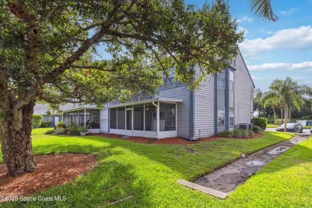 a view of a house with a yard porch and sitting area
