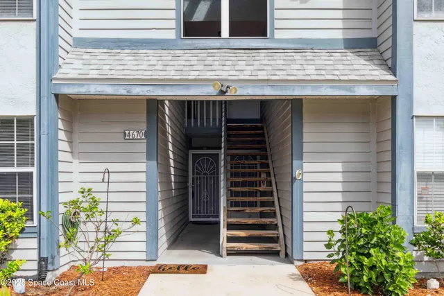 a view of a wooden door of the house