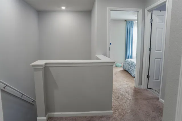 a bedroom with a large bed and a dresser