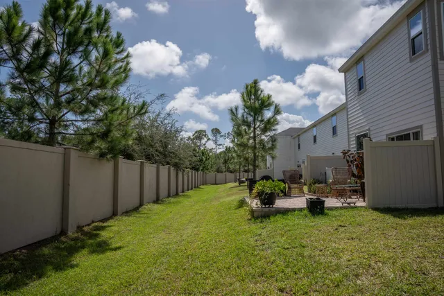 a backyard of a house with lots of green space