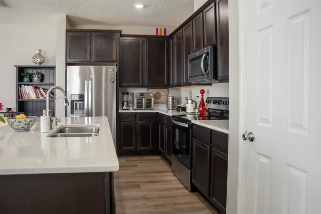 a view of entryway with stairs and wooden floor