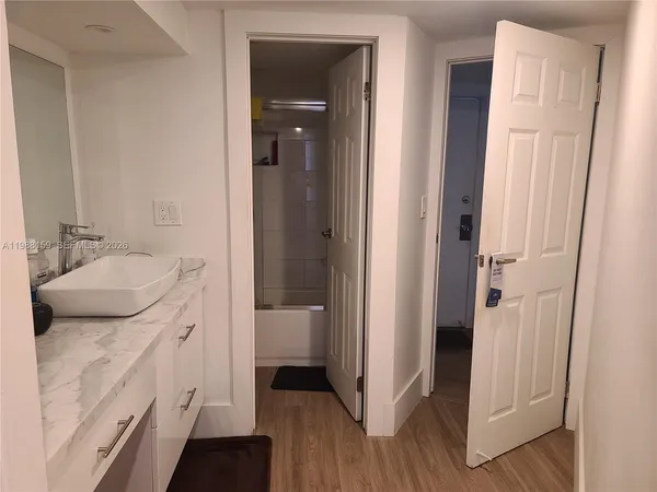 a bathroom with a sink and a mirror