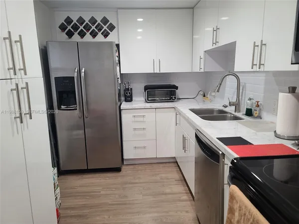 a kitchen with a stove and a microwave