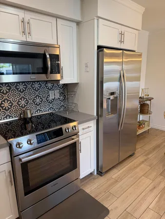 a kitchen with a stove microwave and refrigerator