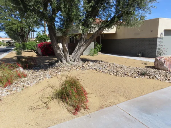 a view of a backyard of the house