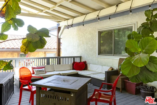 a view of a backyard with wooden fence