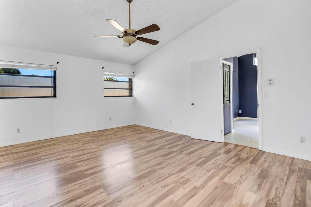 5720 West Waterford Drive Davie, FL 33331 - Photo 12 of 25 a view of empty room with wooden floor